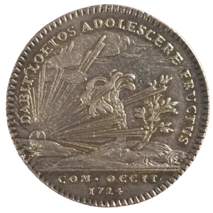 Le soleil levant, entourant de ses rayons un palmier et un olivier sur un mont.