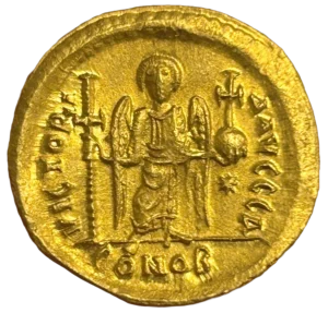 Ange debout de face, les ailes déployées, tenant une croix de la main droite et un globe crucigère de la main gauche ; étoile à huit rais.