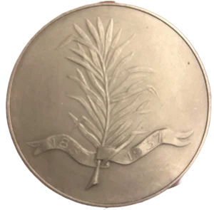 une palme sur laquelle s'enroule un ruban indiquant 1837-1937