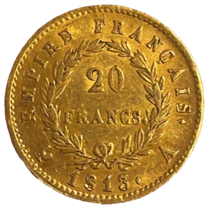 L'inscription 20 FRANCS dans une couronne formée de deux branches de laurier.