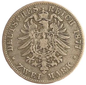Aigle couronné aux ailes déployées et décoré d'un blason.