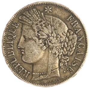 Tête de Cérès surmontée d'une couronne faite d'un ruban, de fleurs, d'épis de blé, de feuilles de laurier et de chêne. Un collier de perle entoure son cou.