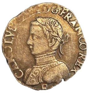 Buste cuirassé et lauré de. Charles IX à gauche.