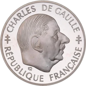 Tête du Général de Gaulle à droite, légende circulaire flanquée de croix de lorraine.