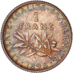 1 FRANC au-dessus d'une branche d’olivier.