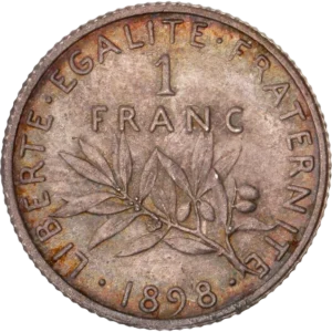 1 FRANC au-dessus d'une branche d’olivier.