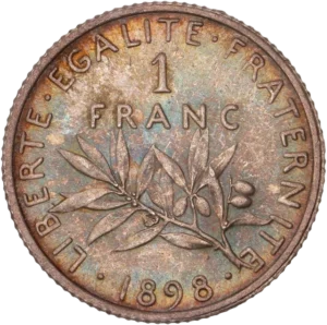 1 FRANC au-dessus d'une branche d’olivier.