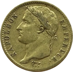Tête laurée de Napoléon Ier à gauche.