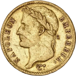 Tête laurée de Napoléon Ier à gauche.