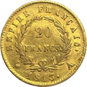 Tête laurée de Napoléon Ier à gauche.