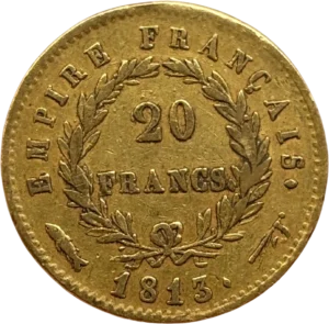 L'inscription 20 FRANCS dans une couronne formée de deux branches de laurier.