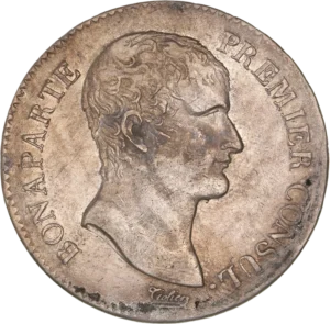 Tête nue de Napoléon Ier à droite.