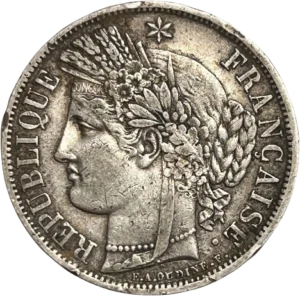 Tête de Cérès surmontée d'une couronne faite d'un ruban, de fleurs, d'épis de blé, de feuilles de laurier et de chêne. Un collier de perle entoure son cou.