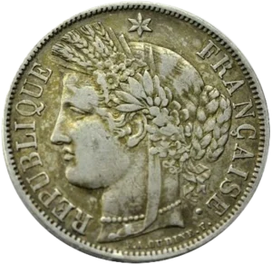 Tête de Cérès surmontée d'une couronne faite d'un ruban, de fleurs, d'épis de blé, de feuilles de laurier et de chêne. Un collier de perle entoure son cou.