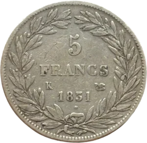 L'inscription "5 francs 1831 K" entouré d'une couronne de laurier et de chêne.