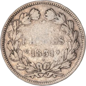 L'inscription "5 francs 1831 Q" entouré d'une couronne de laurier et de chêne.