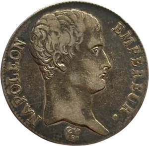 Tête nue de Napoléon Ier à droite.