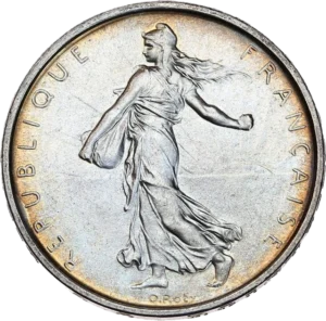 5 francs au dessus d'une branche d'olivier.