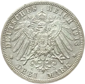 Aigle couronné aux ailes déployées et décoré d'un blason.