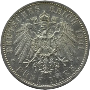 Un aigle aux ailes déployées et couronné, tenant en son centre les armoiries.