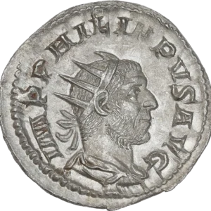 Buste radié, drapé et cuirassé de Philippe Ier à droite.