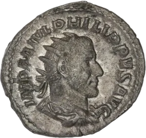 Buste radié, drapé et cuirassé de Philippe Ier à droite.