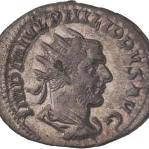 Buste radié, drapé et cuirassé de Philippe Ier à droite.