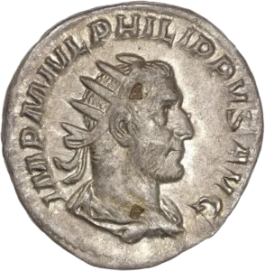 Buste radié et drapé de Philippe Ier à droite.