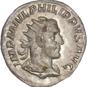 Buste radié et drapé de Philippe Ier à droite.