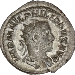 Buste radié, drapé et cuirassé de Philippe Ier à droite.