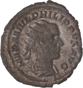 Buste radié, drapé et cuirassé de Philippe Ier à droite.