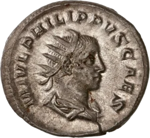 Buste radié et drapé de Philippe II à droite.