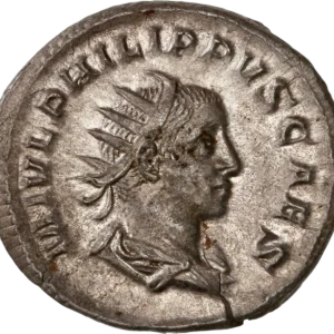 Buste radié et drapé de Philippe II à droite.