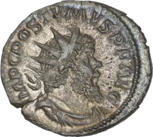 Buste radié, drapé et cuirassé de Postume à droite.