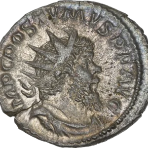 Buste radié, drapé et cuirassé de Postume à droite.