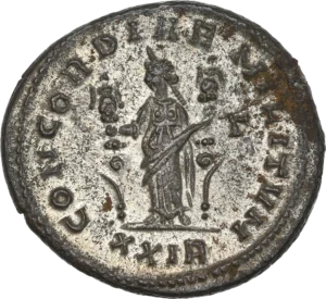 La Concorde drapée, debout de face regardant à gauche, tenant une enseigne militaire dans chaque main.