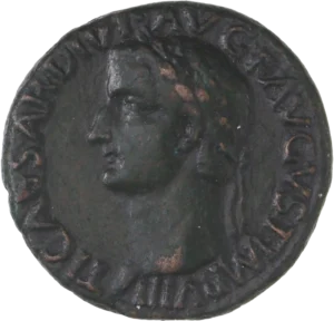 Tête laurée à gauche.