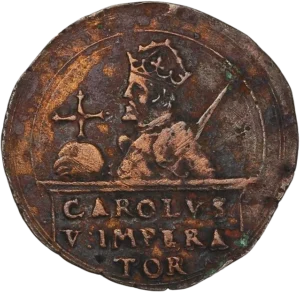 Buste à mi-corps de Charles Quint à gauche, tenant un globe crucigère et l’épée levée.