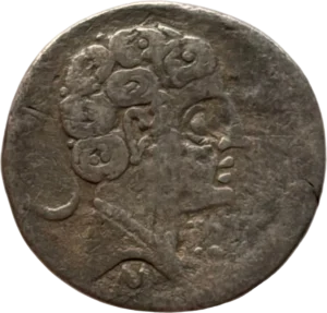 Tête masculine à droite.