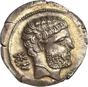 Tête nue et barbue à droite.