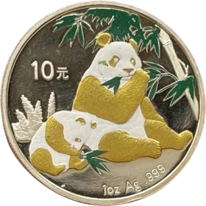 Jeune panda et adulte mangeant du bambou.