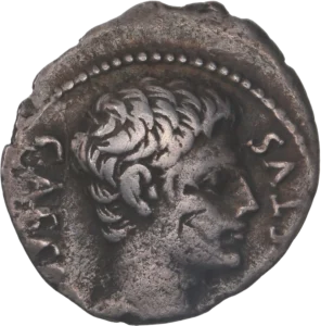 Inscription en latin entourant une couronne végétale.