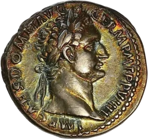 Tête laurée de Domitien à droite.