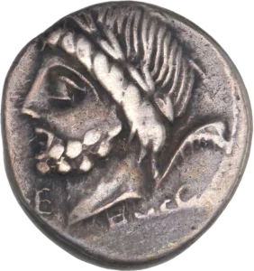 Tête laurée de Saturne à gauche.