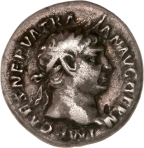 Tête laurée de Trajan à droite.