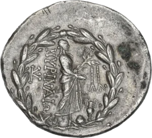 Dans une couronne de lauriers, Apollon marchant à droite, tenant un phiale et une branche de laurier à laquelle sont suspendues deux bandelettes. A ses pieds à droite, l'omphalos et une amphore.