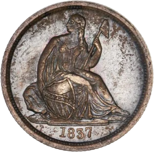 La liberté drapée assise à droite, tenant un bouclier frappé du mot "LIBERTY" et un sceptre surmonté d'un bonnet phrygien.