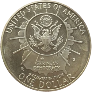 Le Grand Sceau des États-Unis avec un soleil éclatant et un contour des États-Unis. Une étoile est placée à l'emplacement du Mont Rushmore.