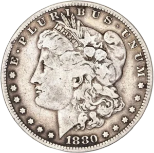 Tête de l'allégorie de la Liberté tournée à gauche et portant le bonnet phrygien, un ruban marqué LIBERTY et une couronne végétale.