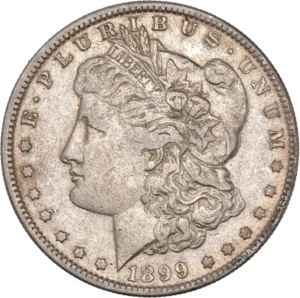 Tête de l'allégorie de la Liberté tournée à gauche et portant le bonnet phrygien, un ruban marqué LIBERTY et une couronne végétale.